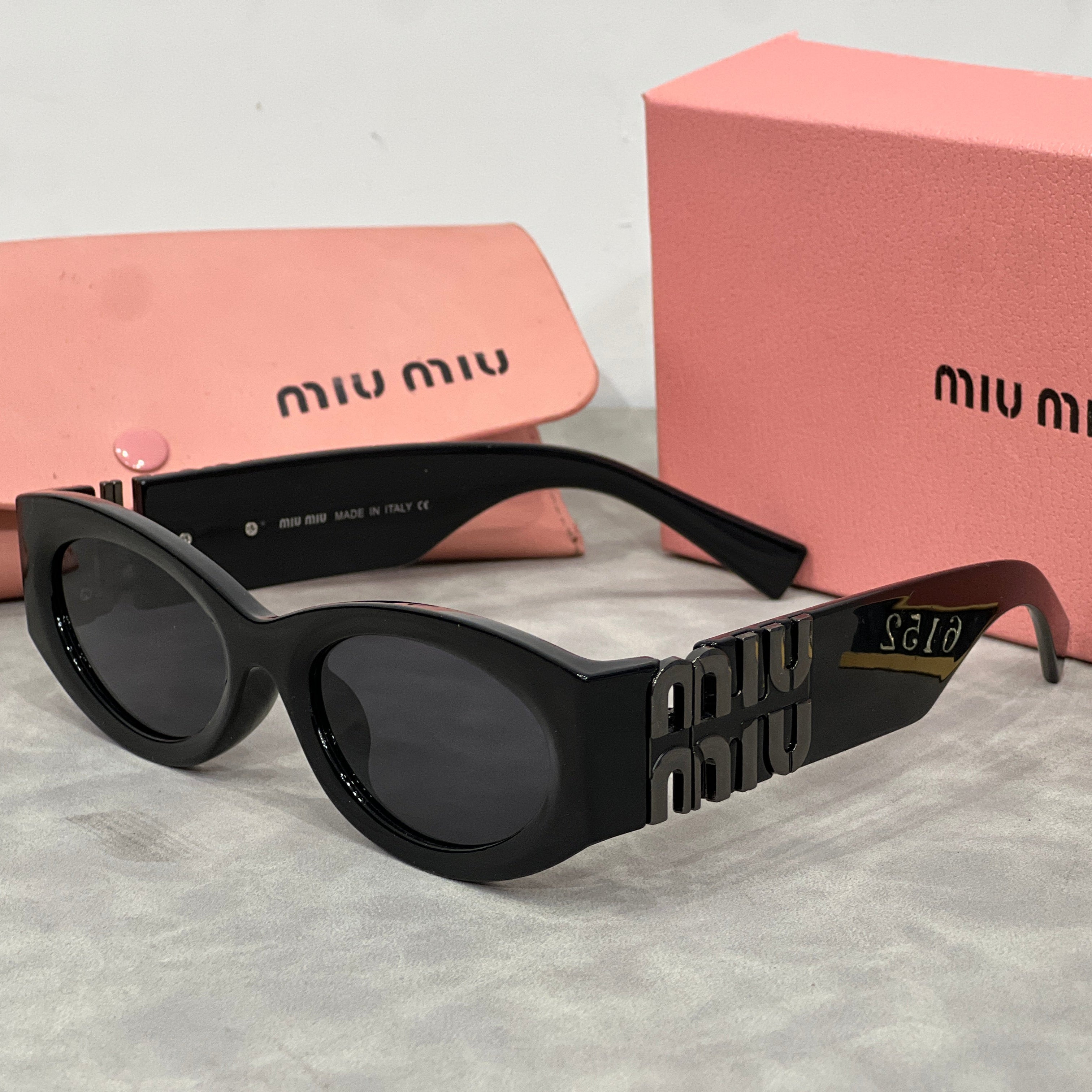 Miu Miu Cat Eye Sunglasses with Logo